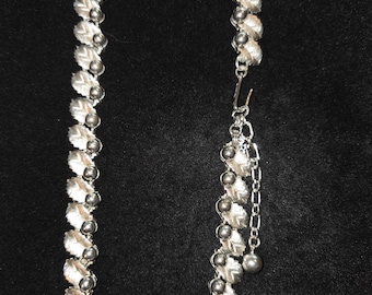 Signed vintage Trifari silver-tone choker necklace with leaf and bead design.