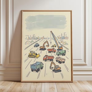 May include: A framed print featuring a colorful illustration of various construction vehicles, including excavators, dump trucks, and a crane, working on a construction site. The artwork has a whimsical, hand-drawn style with a light beige background and a cityscape in the distance.