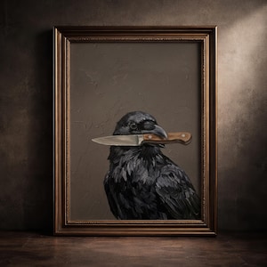 May include: A framed oil painting featuring a black raven holding a silver knife with a brown wooden handle in its beak. The bird is set against a textured dark brown background, and the artwork is enclosed in a decorative bronze-colored frame.