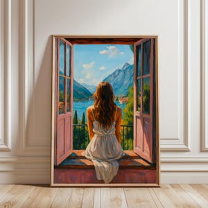 May include: A framed painting depicts a woman in a white dress seated on a windowsill, gazing out at a scenic view. The artwork showcases a lake, mountains, and a blue sky, framed by open pink window panels. The painting is set in a room with white paneling and a wooden floor.