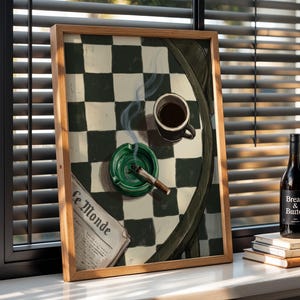 May include: A framed artwork depicts a still life with a cup of coffee, a lit cigarette in a green ashtray, and a newspaper. A bottle of wine and a stack of books are in the background. The artwork is set against a window with blinds.