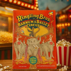 May include: A vintage Ringling Bros. and Barnum & Bailey Circus souvenir program and magazine. The cover is red with illustrations of elephants and performers. The text "POPCORN" is visible in the background, along with a container of popcorn.