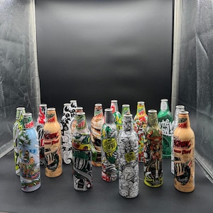 Mountain Dew Green Label Art Aluminum Bottle Collection – Set of 18 Artist Series Limited Edition Cans (2007–2010s)