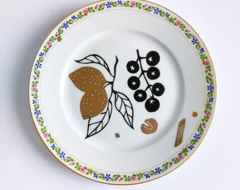 Antique plate screenprinted with tomatoes, pasta and lemons in black and gold, illustrated by Celinda. diameter 24 cm