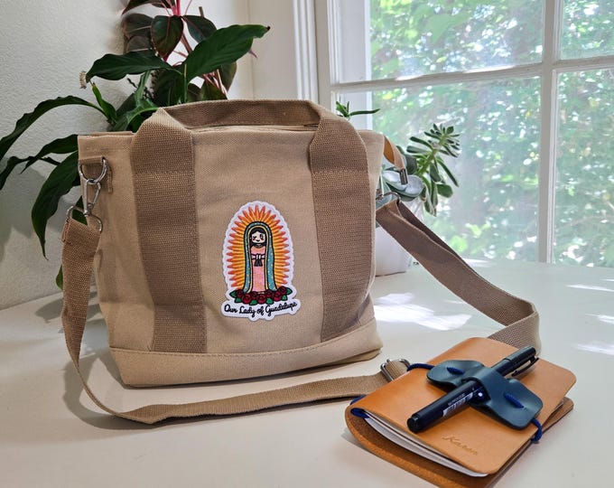Featured listing image: High Capacity Marian Crossbody Tote, Tan Canvas Travel Bag with Zipper, Embroidered Organizer Purse with Holy Trinity Design
