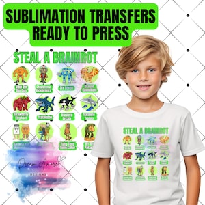 Puede incluir: Camiseta blanca con un gráfico colorido de personajes de dibujos animados y el texto "STEAL A BRAINROT". La imagen también presenta el texto "SUBLIMATION TRANSFERS READY TO PRESS" y el logotipo de Dream Amore Designs.