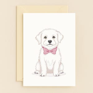 Biglietto di auguri con cucciolo adorabile con fiocco rosa