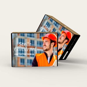 May include: Two brown boxes featuring the text "Stellr Construct CONSTRUCTION THEME 2.0" and an image of a construction worker in an orange vest and hard hat. The boxes are positioned at an angle.
