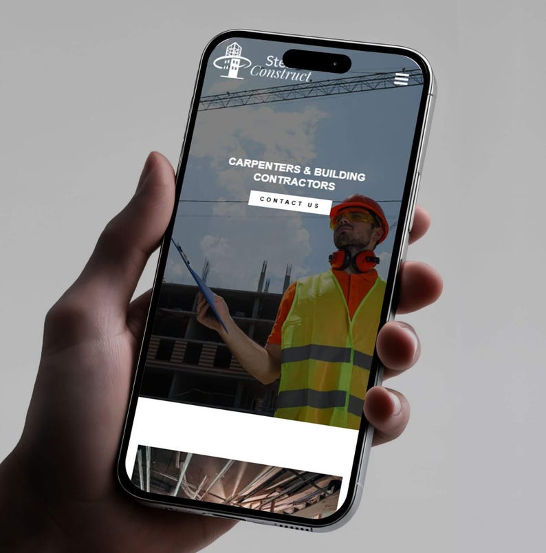 May include: A smartphone screen shows a website for Ste Construct, a carpentry and building contractor. The website features a construction worker in a hard hat and safety vest. The text on the screen reads "CARPENTERS & BUILDING CONTRACTORS" and "CONTACT US".