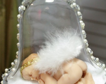 Baby's 1st Christmas ornament. Miniature clay baby angel ornament in a hanging bell