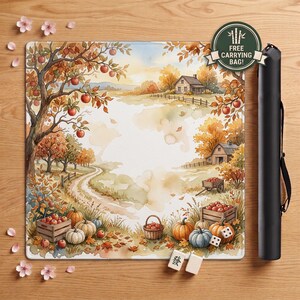 May include: A square playmat featuring a watercolor autumn landscape with apple trees, pumpkins, and farm buildings, accompanied by a black carrying case. A circular green badge on the mat displays the text FREE CARRYING BAG.