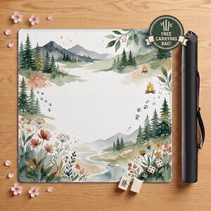 May include: A square playmat featuring a watercolor landscape of mountains, pine trees, a winding river, and wildflowers. The design includes animal paw prints, two campfires, and a circular badge with the text FREE CARRYING BAG. Includes a black cylindrical carrying case and three mahjong tiles.
