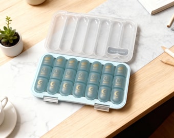 Daily pill organizer, weekly pill organizer, vitamin storage box, pill container, travel pill case, 7-day pill organizer.