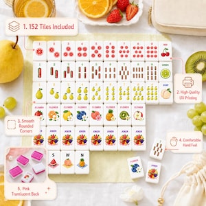 May include: A set of 152 white Mahjong tiles featuring colorful fruit and flower illustrations with smooth rounded corners. The tiles display numbers 1-9 in red, green, and yellow, plus flower and joker tiles with pink translucent backs.