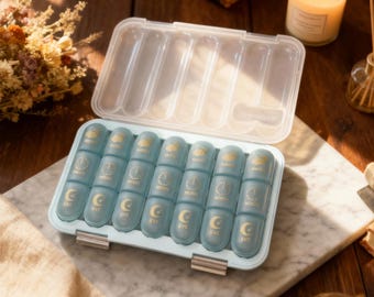 Daily pill organizer, weekly pill organizer, vitamin storage box, pill container, travel pill case, 7-day pill organizer.