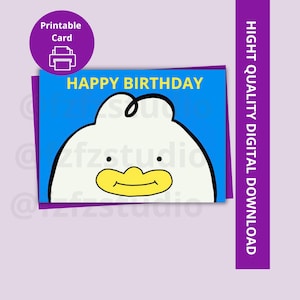 May include: A printable birthday card featuring a cartoon duck face with a yellow beak and black eyes. The card has a blue background with the words "HAPPY BIRTHDAY" in yellow. A purple circle with a printer icon is in the upper left corner.