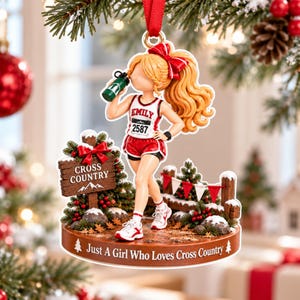 May include: A decorative Christmas ornament featuring a runner with blonde hair in a ponytail and a red bow, wearing a white tank top with the name Emily and number 2587, red shorts, and sneakers. The base reads Just A Girl Who Loves Cross Country.