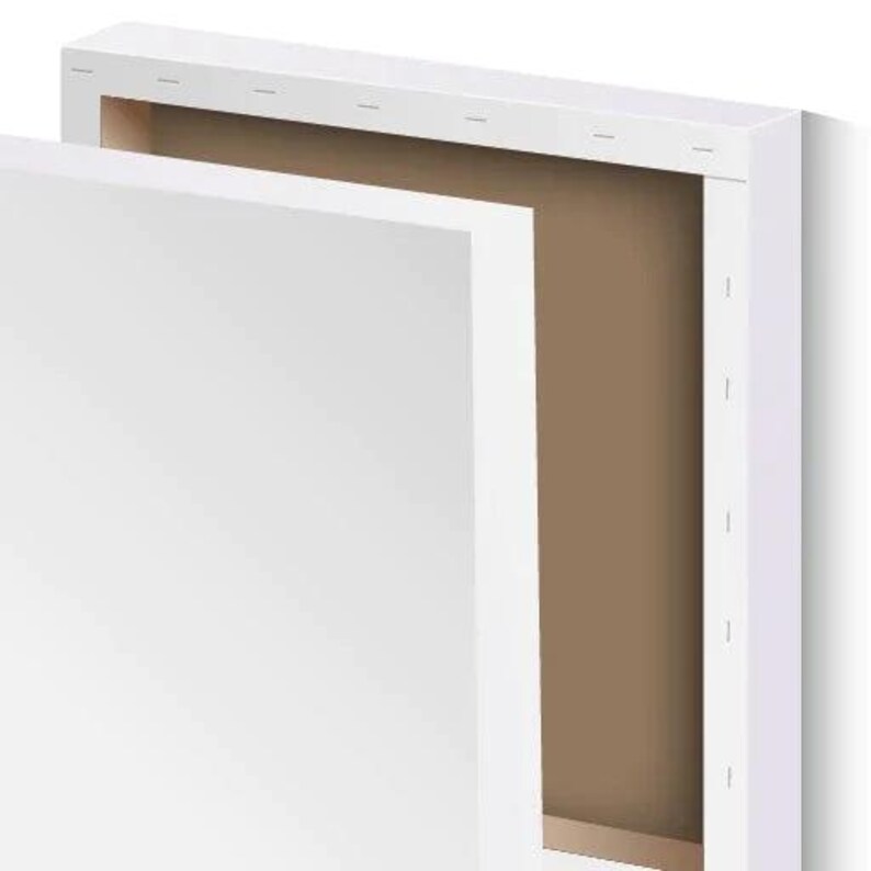 May include: A white canvas stretched over a wooden frame, with a second canvas panel partially removed, revealing the brown interior. The artwork is ready to be displayed or used for painting.
