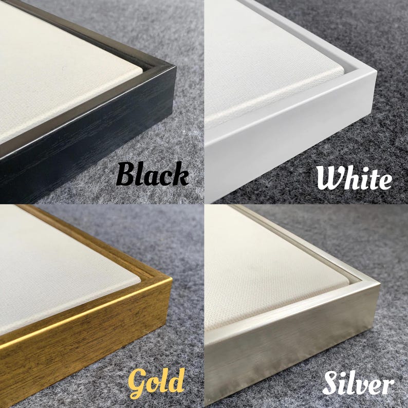 May include: Four framed canvases with different coloured frames: black, white, gold, and silver. Each frame surrounds a white canvas. The colours of the frames are labelled with the words "Black", "White", "Gold", and "Silver".