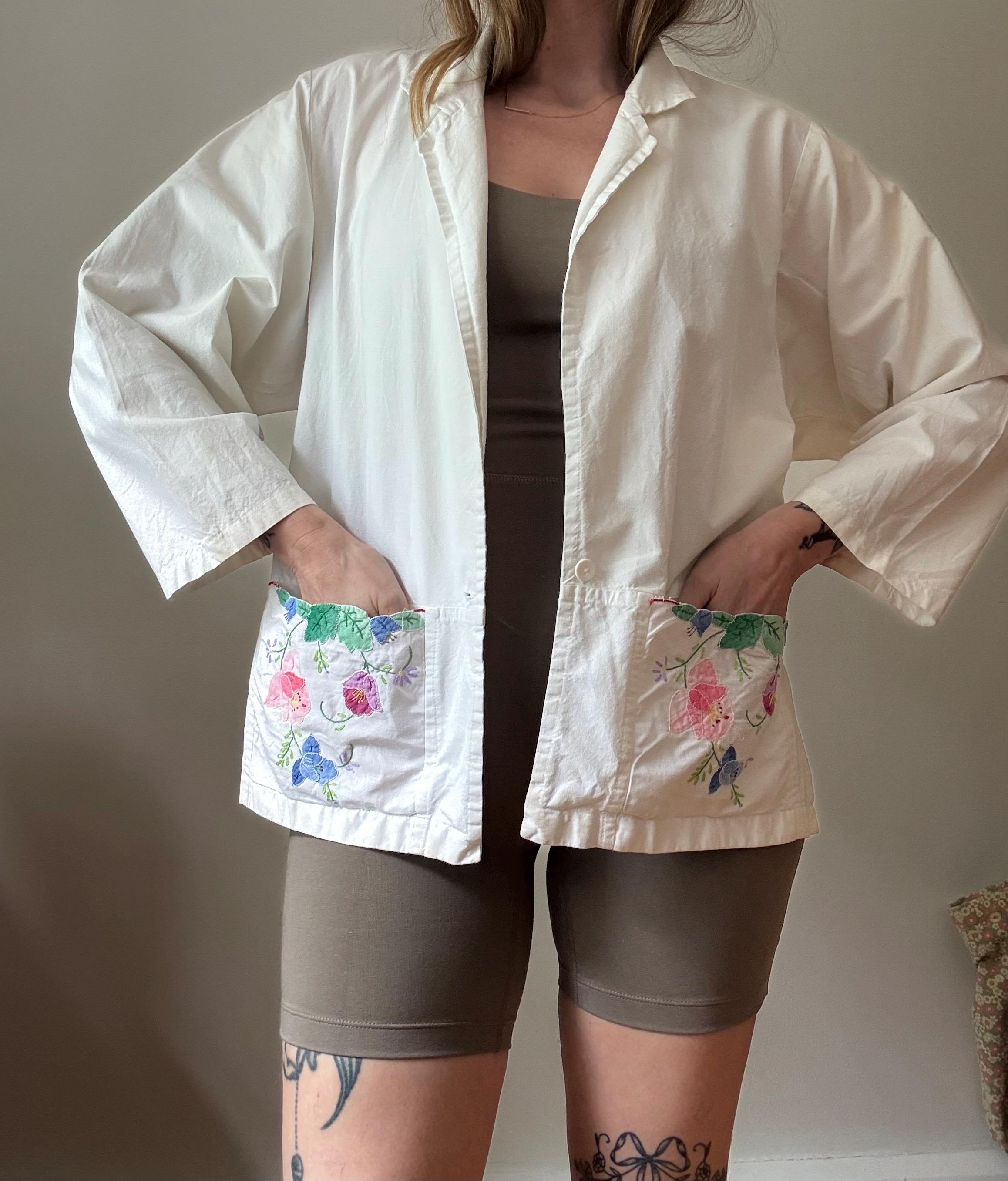 1970s white cotton jacket with floral applique pockets by Dragonfly small 70s