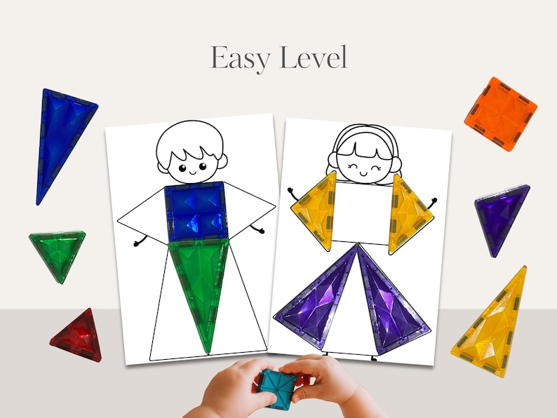 May include: Educational toy set with magnetic tiles and outline drawings of figures. The text "Easy Level" is displayed above the drawings. The set includes blue, green, orange, red, and purple geometric shapes. A child's hands are holding a blue square.