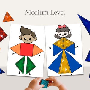 May include: Educational toy set featuring magnetic tiles and illustrated cards. The cards depict cartoon figures constructed from geometric shapes. The text "Medium Level" is displayed above the cards. Various colored magnetic tiles are scattered around the cards.