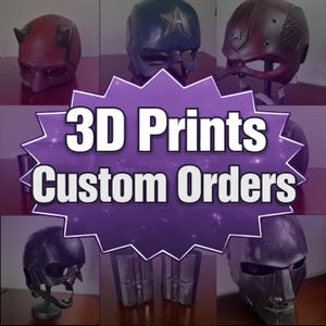 May include: A selection of 3D-printed superhero helmets and accessories. The image shows a red horned mask, a blue helmet with a star, and a burgundy helmet with a star. The text "3D Prints Custom Orders" is displayed in a purple burst.