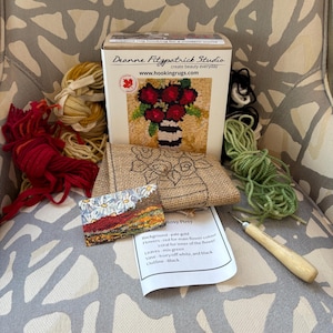 May include: A set of three ceramic mugs with a speckled, matte finish. Each mug features a different color: light blue, cream, and gray. The mugs have a simple, modern design and a comfortable handle. Perfect for coffee or tea.