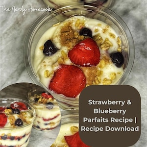 May include: A close-up of layered parfaits in clear plastic cups. The parfaits feature a creamy base, topped with sliced strawberries, blueberries, granola, and a sprinkle of cinnamon. The text "Strawberry & Blueberry Parfaits Recipe | Recipe Download" is visible.