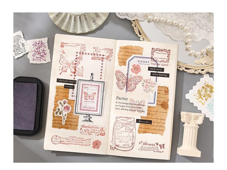 May include: Open journal with butterfly and floral stamps in red ink. Includes a framed butterfly specimen, ticket, and jar illustrations. Decorative elements include torn paper, ink pad, and small decorative pillar.