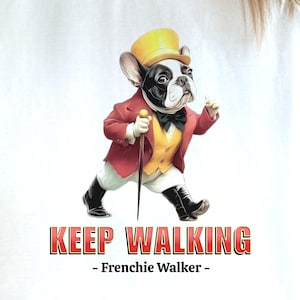 May include: A whimsical illustration of a French Bulldog dressed in a red coat, yellow vest, and top hat, holding a cane. The text "KEEP WALKING - Frenchie Walker -" is displayed below the dog.