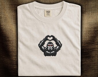 Bigfoot Heart Hands Embroidered T-Shirt: Funny Sasquatch Heart Hand Sign | Cryptid Shirt | Bigfoot Silhouette Embroidery | Comfort Colors®