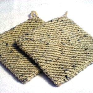 May include: A pair of beige crocheted pot holders with a speckled pattern. The pot holders have a loop handle.