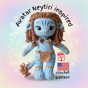 May include: A crocheted doll inspired by Neytiri from Avatar. The doll is light blue with brown hair and accents, and a tan loincloth. The image includes the text "Avatar Neytiri inspired" and "crochet pattern" with a PDF icon and an American flag.