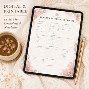 May include: A digital and printable trigger and environment tracker on a tablet, with floral accents. The tablet is next to a cup of tea and a gold stylus. Text on the tablet reads "Trigger & Environment Tracker".
