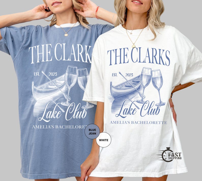 May include: Two oversized t-shirts, one blue jean and one white, featuring a graphic design. The design includes the text "THE CLARKS LAKE CLUB" with a boat, champagne glasses, and the text "EST. 2025". The text "AMELIA'S BACHELORETTE" is also included.