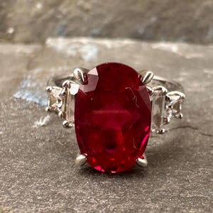 Ruby ring oval cut lab grown cz shoulders vibrant saturated ruby colour July Birthstone UK size K.5 3.52 g (J10487)