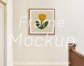 May include: A framed art print featuring a yellow tulip with green leaves on a cream background. The artwork is displayed in a wooden frame on a white wall. Text on the image reads "Frame Mockup" and "PSD file / Square / Canvas / Matte / Glass by raraya shop."