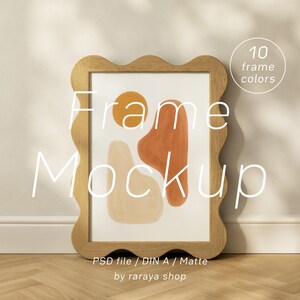 May include: A wooden framed art print with a wavy edge, featuring an abstract design in orange, beige, and yellow. The text "Frame Mockup" is overlaid on the image. Additional text indicates 10 frame colors and "PSD file / DIN A / Matte".