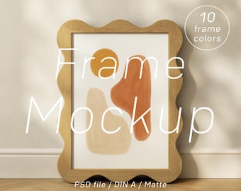 May include: A wooden framed art print with a wavy edge, featuring an abstract design in orange, beige, and yellow. The text "Frame Mockup" is overlaid on the image. Additional text indicates 10 frame colors and "PSD file / DIN A / Matte".