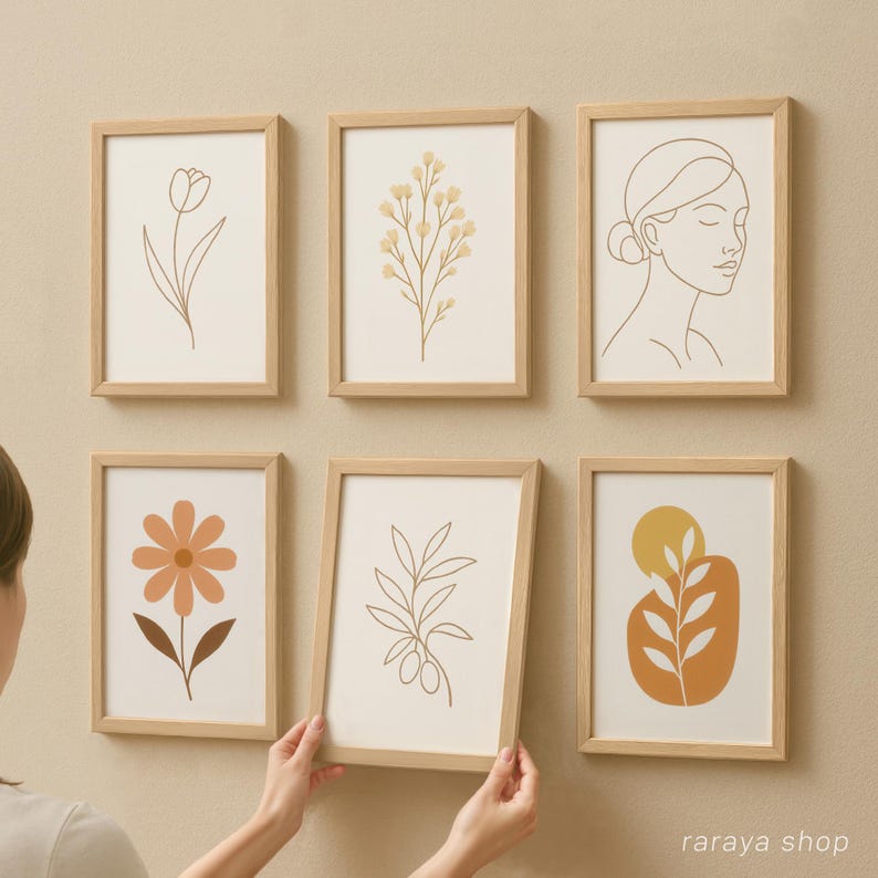 May include: Set of six minimalist line art prints in wooden frames. The prints feature various floral and abstract designs in shades of brown, yellow, and orange.