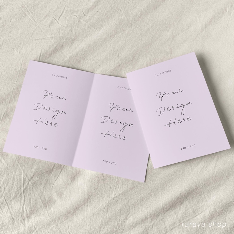 May include: A folded card mockup with a light purple background. The card is 5.5 x 7 inches and has the text "Your Design Here" on each side. The text is in a handwritten font.