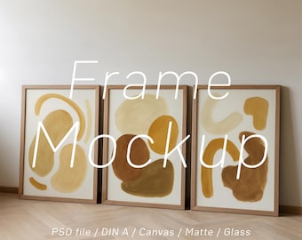 May include: Three framed art prints with abstract shapes in shades of brown and beige. The frames are made of light-colored wood. The text "Frame Mockup" is displayed on the image.