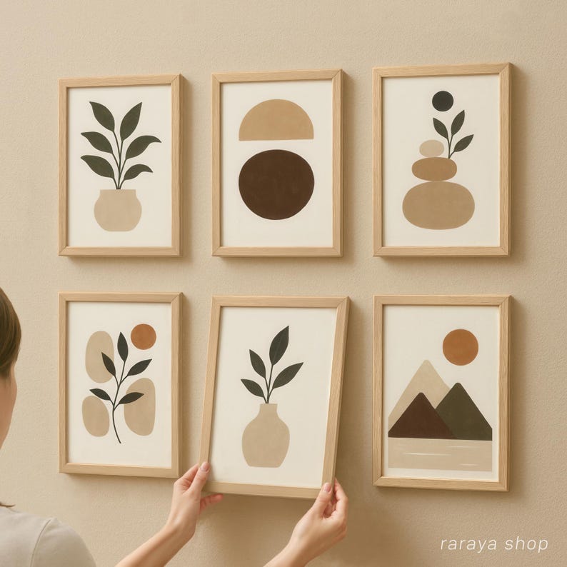 May include: Set of six minimalist art prints in wooden frames with abstract shapes and plants in neutral colors. The prints feature a plant in a pot, a brown circle, stacked stones, a plant in a vase, a mountain range, and a plant with a red circle.