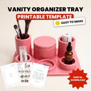 Puede incluir: Una bandeja organizadora de tocador rosa con múltiples compartimentos cilíndricos y un recipiente central con tapa. La imagen incluye el texto VANITY ORGANIZER TRAY, PRINTABLE TEMPLATE, EASY TO MAKE, DIGITAL DOWNLOAD y hojas de instrucciones.