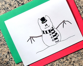 May include: A black and white illustration of a snowman with bat wings, wearing a black top hat and a striped scarf. The snowman is on a white background.