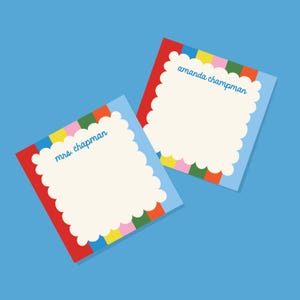 May include: Two square note cards featuring a scalloped cream-colored center bordered by vertical stripes in red, blue, yellow, pink, and green. One card displays the text mrs. chapman and the other displays the text amanda champman in blue.