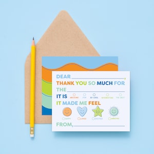 May include: A white card with a blue, orange, and green border. The card says "Dear ____, Thank you so much for the ____. It is ____. It made me feel ____. From, ____". There are four circles with smiley faces to choose from: happy, loved, excited, and amazing.