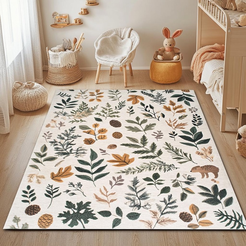 May include: A white area rug with a repeating pattern of green leaves and brown branches. The rug has a light brown background and features a small brown hedgehog in the bottom right corner.
