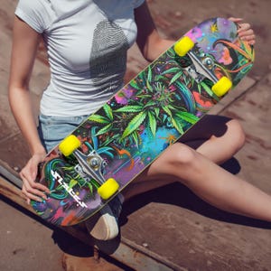 May include: A colorful skateboard with a green marijuana leaf design and yellow wheels. The skateboard has the word "SLATER" printed on it.